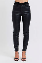 Black faux leather high-waisted skinny pants by Judy Blue with a sleek glossy finish perfect for plus size wear