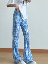 Blue floral print flare leg pants with lightweight fabric and white daisy patterns for a stylish look