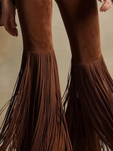 Brown suede fringe flare pants with long flowing fringe detailing at the hem for a stylish flare pants look