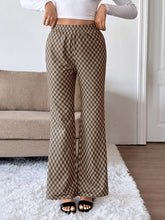 Brown and beige plaid high-waisted wide leg pants with elastic waistband made of soft breathable material with easy care instructions