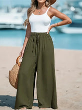 Olive green drawstring wide-leg pants with adjustable waistband designed for comfortable casual wear