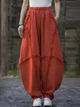 Cotton orange wide-leg frayed edge harem pants featuring layered detailing for a stylish comfortable look