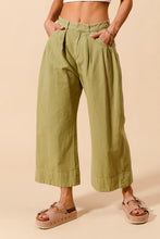 Olive green wide leg SO ME mid rise chino pants with pleated design cuffed hems and pockets with care instructions