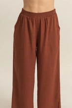 Brown hyfve wide-leg pants with elastic waistband made from soft fabric featuring easy care instructions
