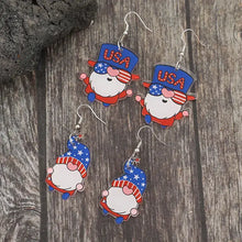 Four pairs of patriotic acrylic gnome dangle earrings