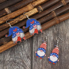 Four pairs of patriotic acrylic gnome dangle earrings