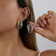 Two-tone stainless steel twisted interlocking oval dangle earrings