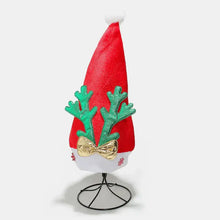 Red 2-piece antler Christmas hat with green reindeer antlers, gold bow, and pompom on stand