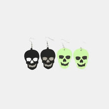 Four pairs of 2 piece PU leather skull dangle earrings in black and glow-in-the-dark green