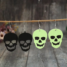 2 piece PU leather skull dangle earrings with black and green skulls