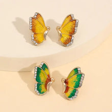 Rose gold-plated alloy butterfly stud earrings, 2 yellow and 2 green with rhinestones