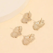 Rose gold-plated alloy butterfly stud earrings with rhinestone accents