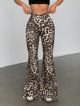 Leopard print high waist flare pants in stretchy form-fitting fabric with bold black and tan leopard print spots