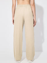 Beige drawstring wide leg pants with elastic waistband in soft fabric for comfortable wide leg wear