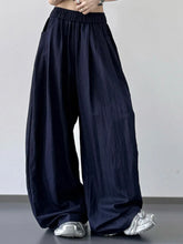 Dark navy wide-leg pants with elastic waistband, loose fit, suitable for machine wash care instructions