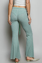 Mint green ribbed knit flare pants with side tie detail made from ribbed knit fabric in the pol drawstring collection