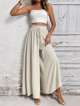 Beige frill wide leg pants with high-waisted elastic drawstring waistband and wide leg silhouette