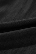 Black fabric with a smooth textured weave pattern from smocked high waist side pockets frilled wide leg pants