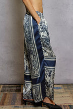 Wide leg satin trousers in blue and white toile floral printed woven fabric with bold navy side stripes from pol