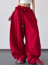 Vibrant red drawstring wide leg pants with loose fit and ruffled waistband for comfortable casual wear