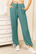 Teal-colored basic bae full size soft rayon drawstring waist pants with elastic waistband and matching ankle ties