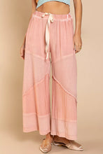 Soft pink pol elastic waistband wide leg pants with drawstring and layered textured fabric panels