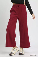 Umgee cable knit textured wide leg pants in burgundy with a drawstring waistband and wide leg design