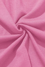 Soft pink knit fabric with subtle ribbed texture gathered in a spiral for knotted waist split leg relaxed pants