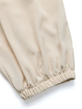 Beige cotton ruched high waist joggers with elastic cuffs designed for comfort and style