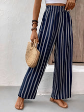 Navy blue and white striped wide leg pants with high waisted elastic waistband and comfortable fit care instructions included
