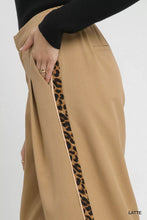 Umgee tan pleated wide-leg pants with bold leopard-print contrast trim and gold detailing on side stripe