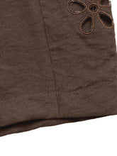Brown linen casual wide leg pants with embroidered floral cutout detail and care instructions for easy maintenance