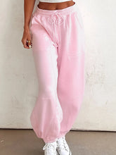 Soft pink casual drawstring sweatpants with elastic waistband and machine wash care instructions for everyday comfort