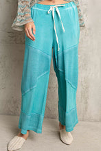 Turquoise corduroy pol elastic waistband wide leg pants with white drawstring and ribbed cuffs for comfort and style