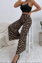 Leopard high waist wide leg pants in flowing fabric with bold black and tan leopard print pattern