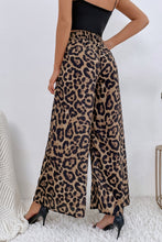 Beige and black leopard high waist wide leg pants featuring a flowy design ideal for stylish casual wear