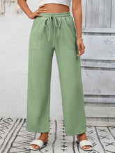 Mint green casual drawstring wide leg pants with front pockets and a comfortable drawstring waist