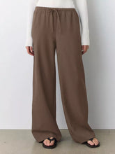 Brown wide leg drawstring pants with elastic waist designed for comfort and casual wear