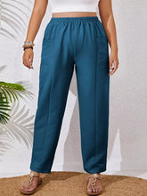 Plus size teal casual pants with relaxed fit elastic waistband fabric blend and two front pockets for comfort