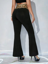 Black high waist flare pants featuring a leopard high waist waistband for stylish and comfortable wear