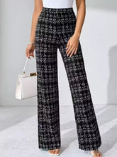 Black and white textured tweed plaid wide-leg pants featuring a classic plaid pattern and comfortable wide-leg fit