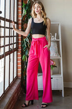 Bright fuchsia Heimish full size wide-leg tie pants with paperbag waistband and drawstring for plus size wear