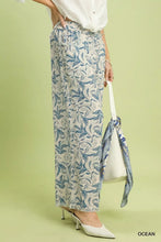 Beige linen printed wide leg raw hem pants with blue botanical print and frayed hems by umgee