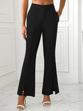 Black high-waisted slit flare pants with side slits button closure and pockets for a stylish flare pants look