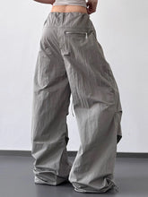 Gray drawstring wide leg cargo pants with relaxed fit and subtle texture in a soft durable fabric
