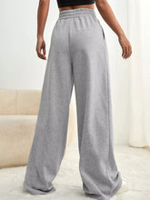 Gray heathered wide leg pants with drawstring waist elastic waistband and side pockets in soft fabric