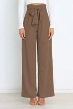 Brown high waist tie front wide leg pants with a tied belt at the waist for a stylish and comfortable fit