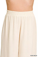 Sand beige wide-leg pants with elastic waistband made from textured lightweight fabric by zenana woven airflow