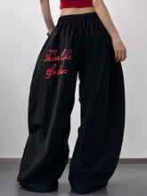 Black heart wide leg casual pants with pink embroidered shine like the stars text for comfortable leg casual wear