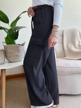 Black ribbed high-waisted wide-leg pants with drawstring waist and cargo pockets machine wash tumble dry safe